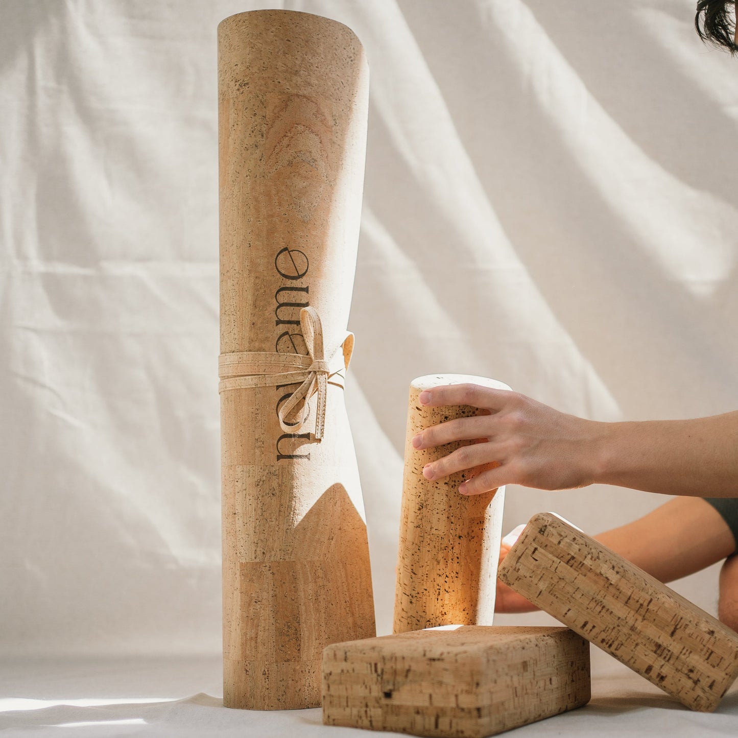 Noveme Yoga Set featuring a cork yoga mat, two yoga blocks and a cork roller