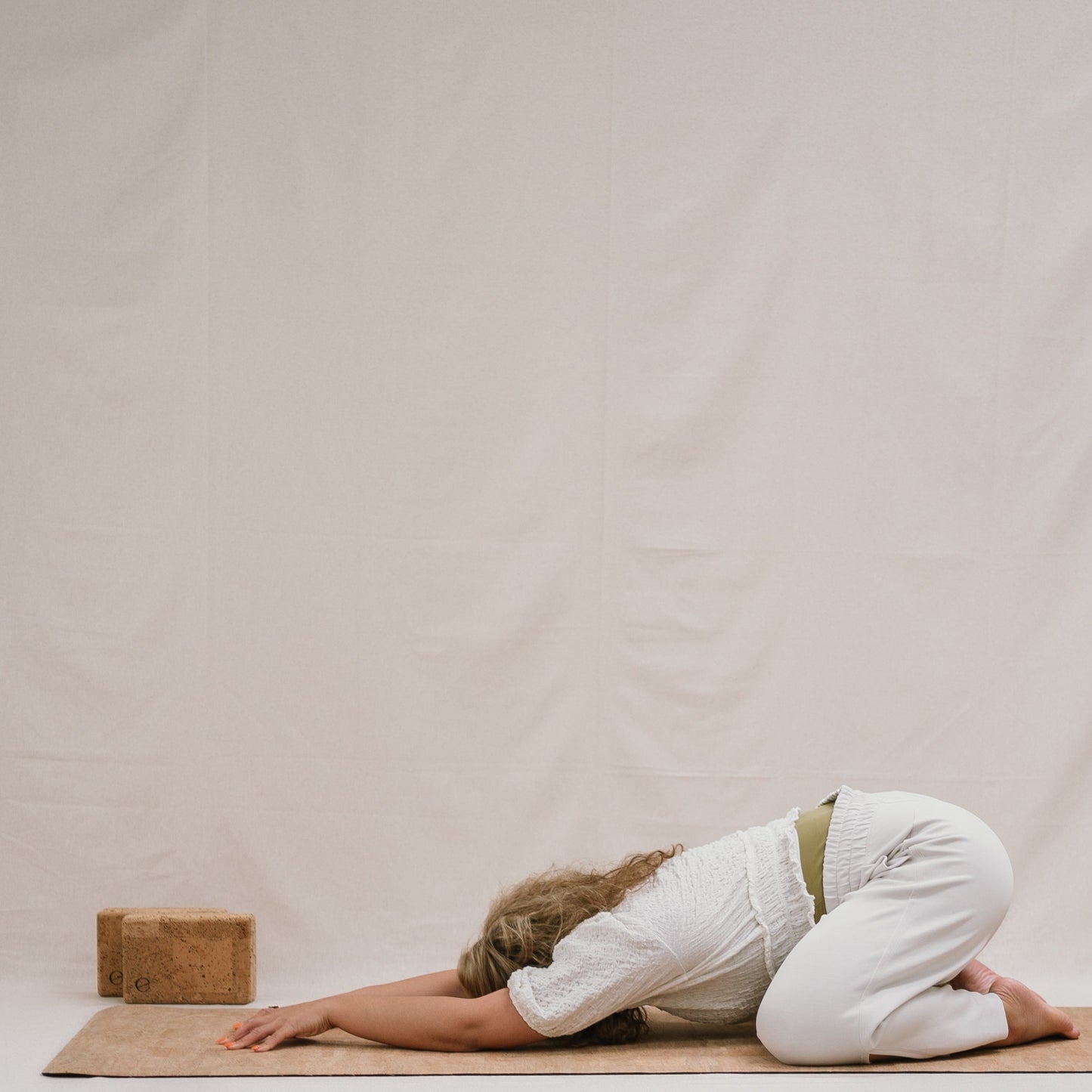 Yogi using Noveme yoga mat and block set