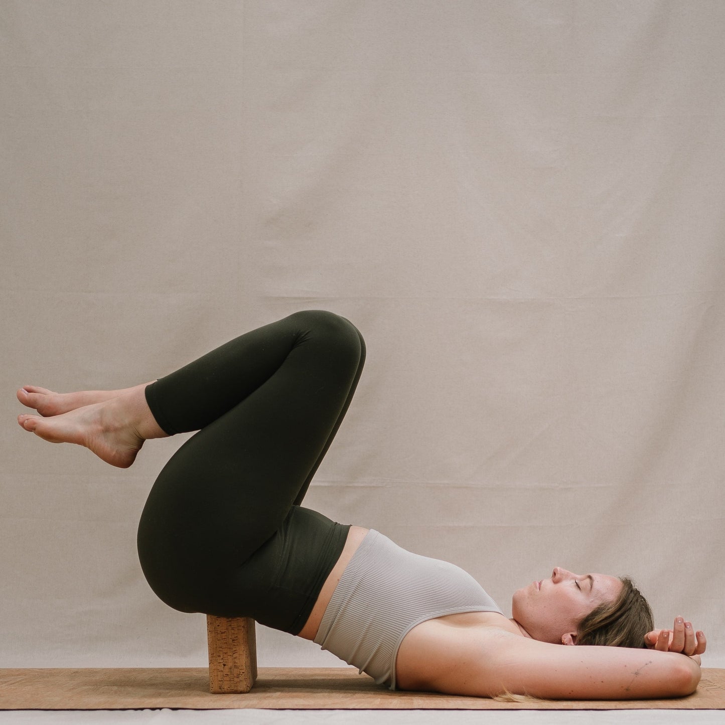 Yogi using Noveme yoga mat and block set