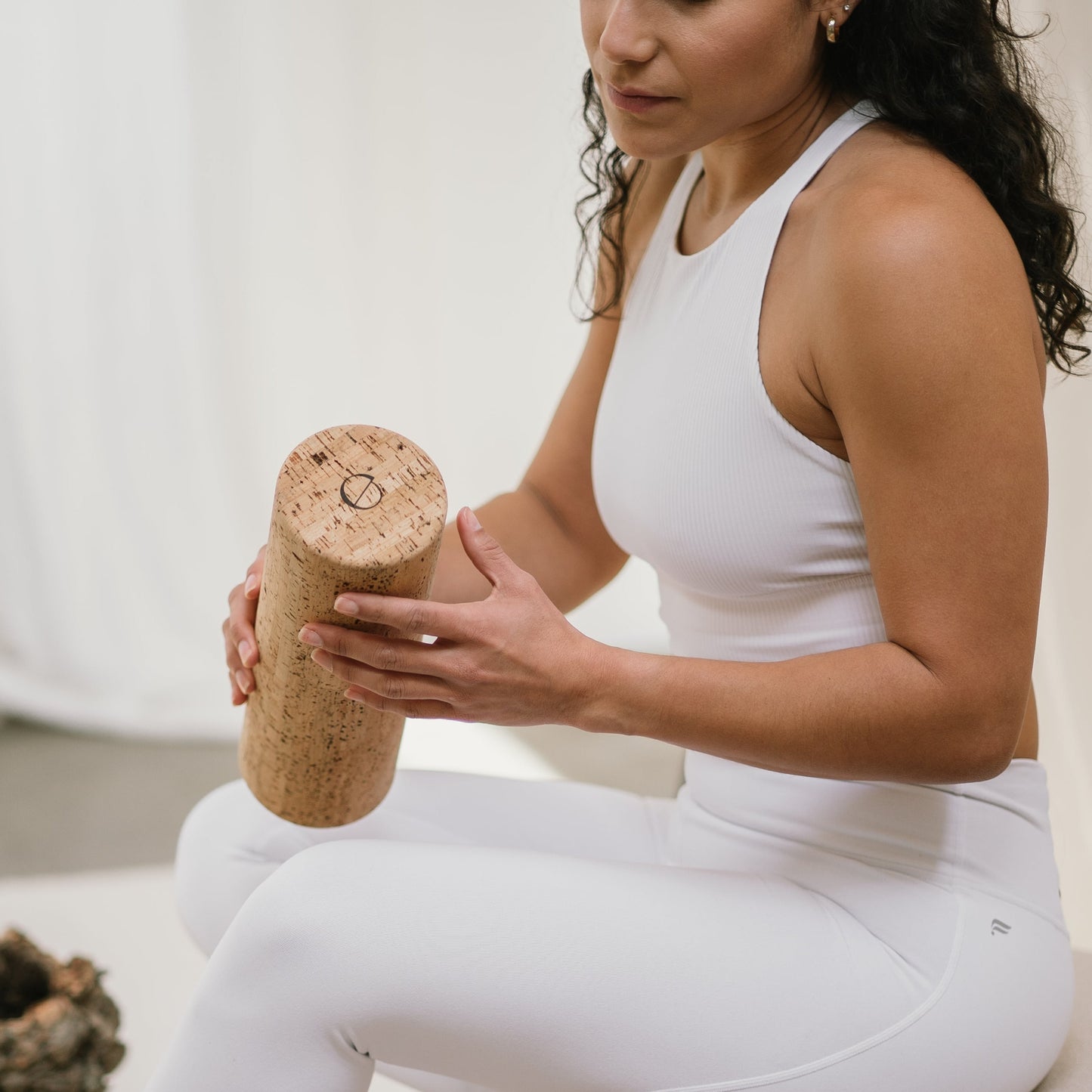 model holding a noveme cork roller