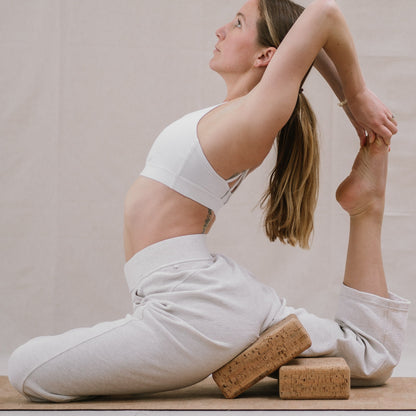 Yogi using Noveme yoga mat and block set